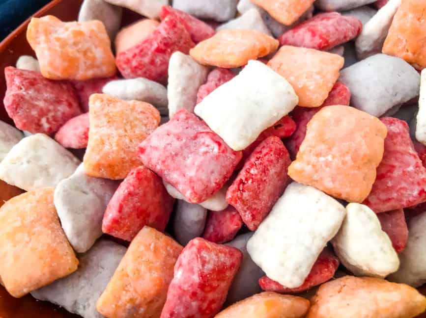 Close up of colored Tampa Bay Buccaneers Puppy Chow in red, orange, white, and gray