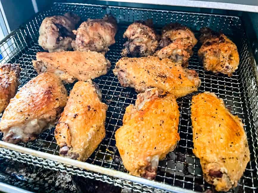 Air fryer chicken wings in the air fryer basket