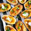 Air Fryer Potato Skins filled with bacon, cheese, sour cream, and chives