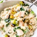 A fork digging into a bowl of Chicken and Leek Risotto