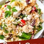Pin image for Greek Orzo Salad in a bowl with a spoon digging into it