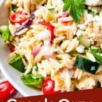 Pin image close up of Greek Orzo Salad with title at bottom