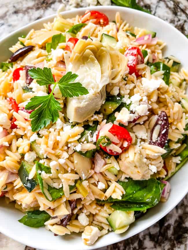 A bowl full of the pasta and vegetables