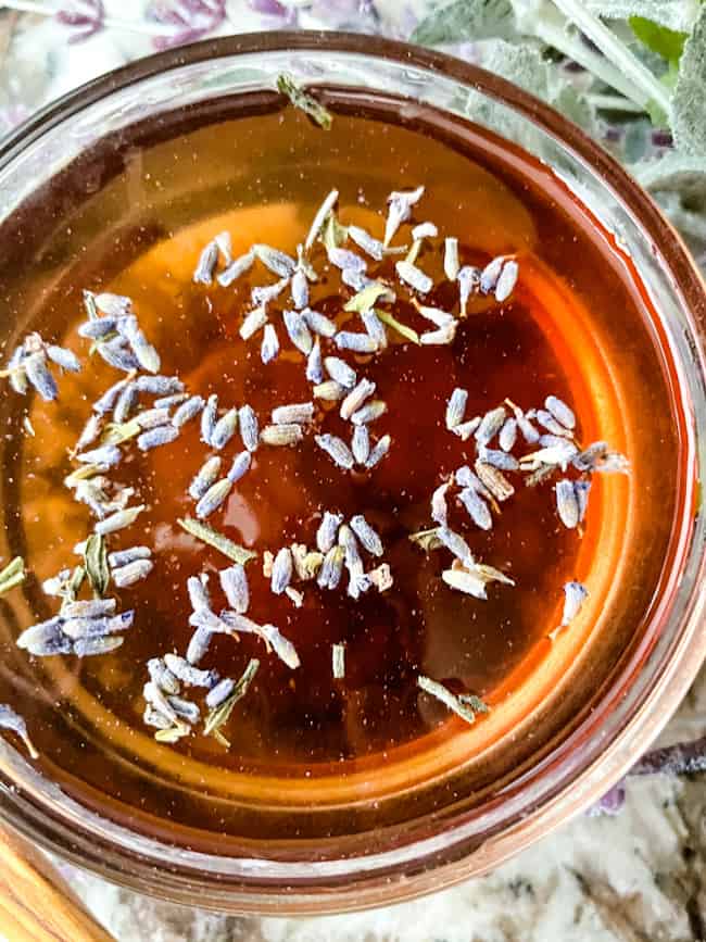 Close up of the syrup in a bowl with flowers on top