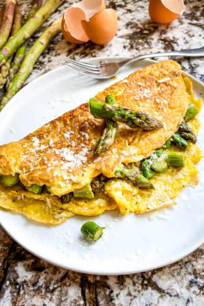 Asparagus Omelette on a white round plate