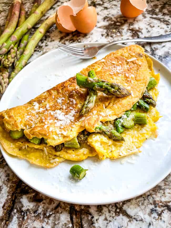 Asparagus Omelette on a white round plate