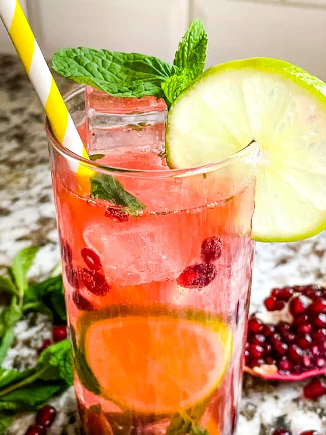 A close up of a cocktail with a straw in it