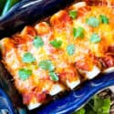 A blue dish filled with Southwest Ground Turkey Enchiladas