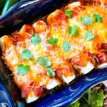 A blue dish filled with Southwest Ground Turkey Enchiladas