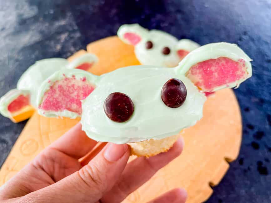 A hand holding a Baby Yoda Cupcakes