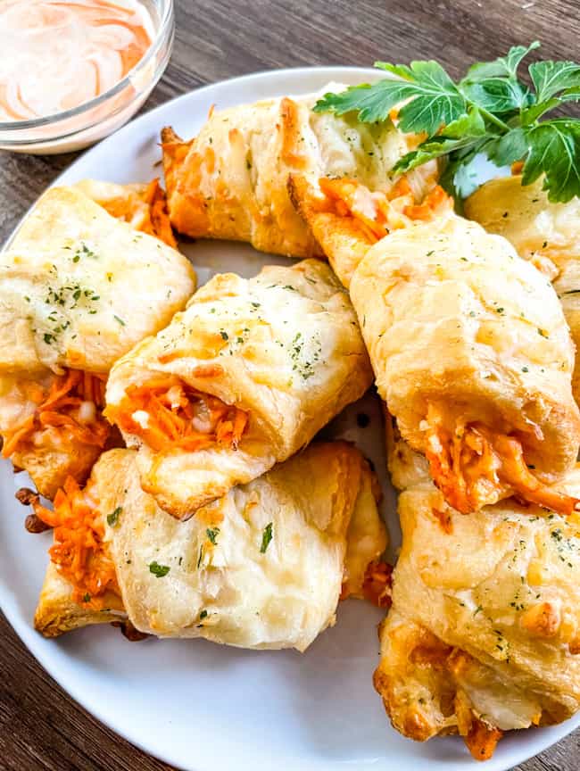 A pile of Buffalo Chicken Crescent Rolls on a white plate
