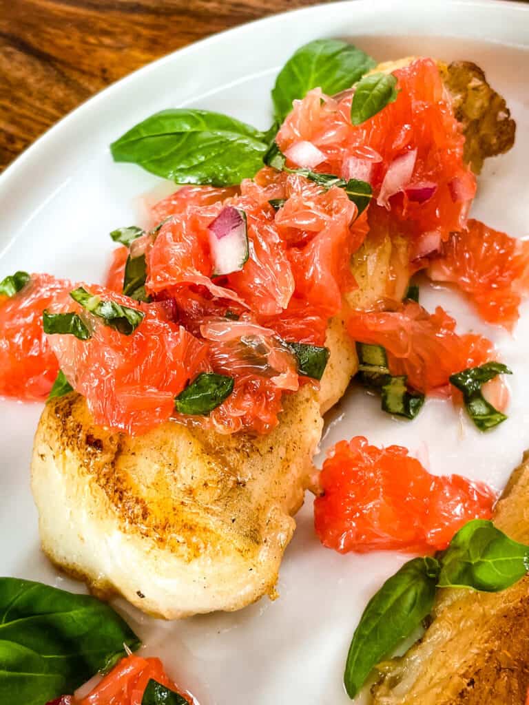 Close up of a fish steak with the citrus topping