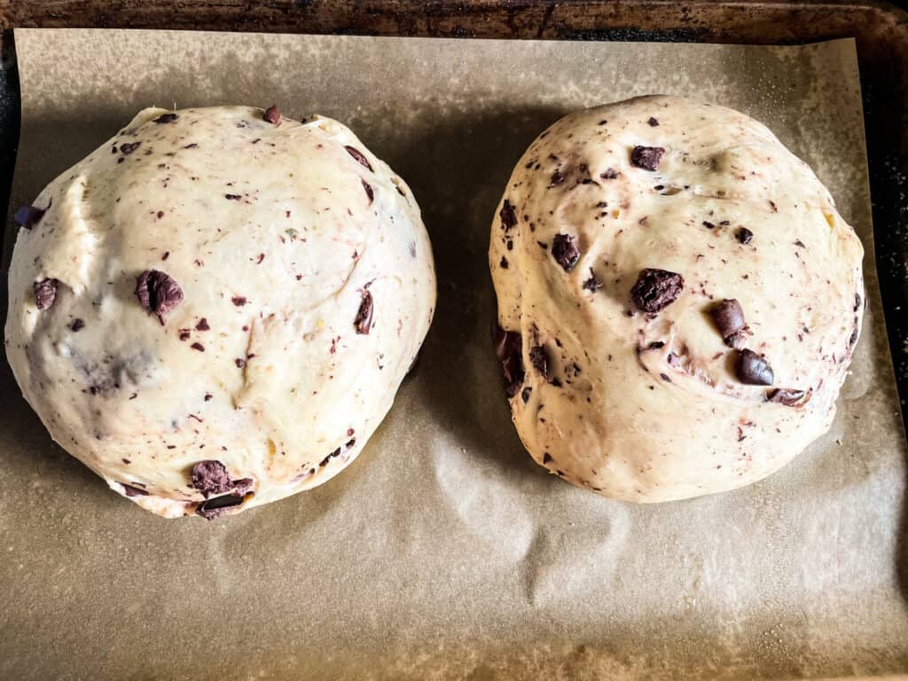 Raw Sourdough Olive Bread dough on a baking sheet