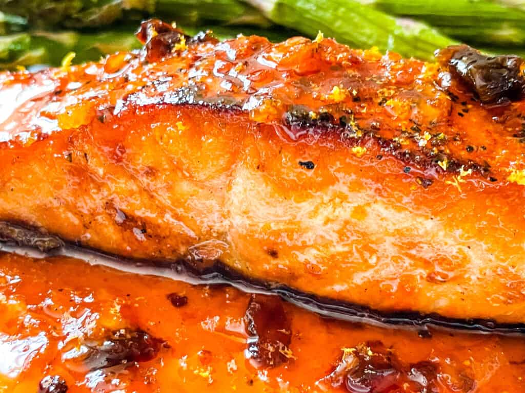 Side view of a fish steak with the sauce under it