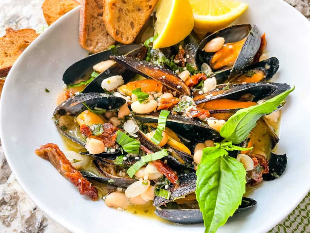 A bowl of the shellfish and sauce