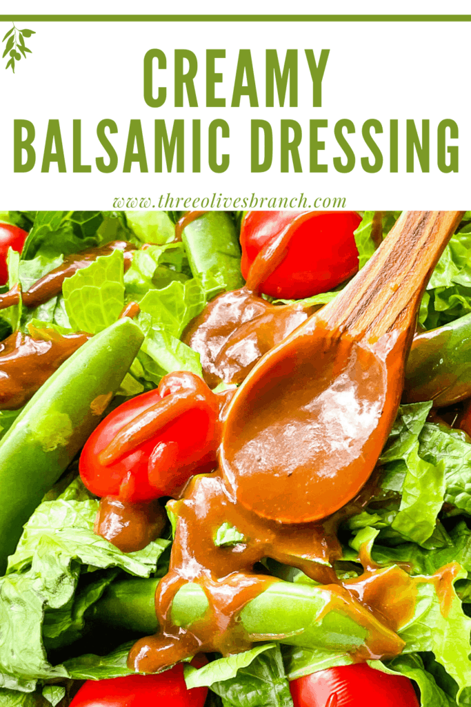 Pin image of Creamy Balsamic Dressing being poured over a salad with title at top