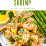 Pin image of Lemon Pepper Shrimp piled on a plate with title at top