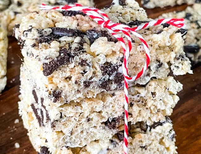A stack of Oreo Rice Krispie Treats tied with a red and white twine