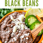 Pin image of Black Refried Beans in a bowl with wood spoon and title at top