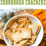 Pin image for Rosemary Sourdough Crackers on a charcuterie cheese board with title at top