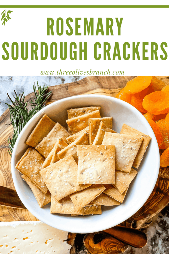 Pin image for Rosemary Sourdough Crackers on a charcuterie cheese board with title at top