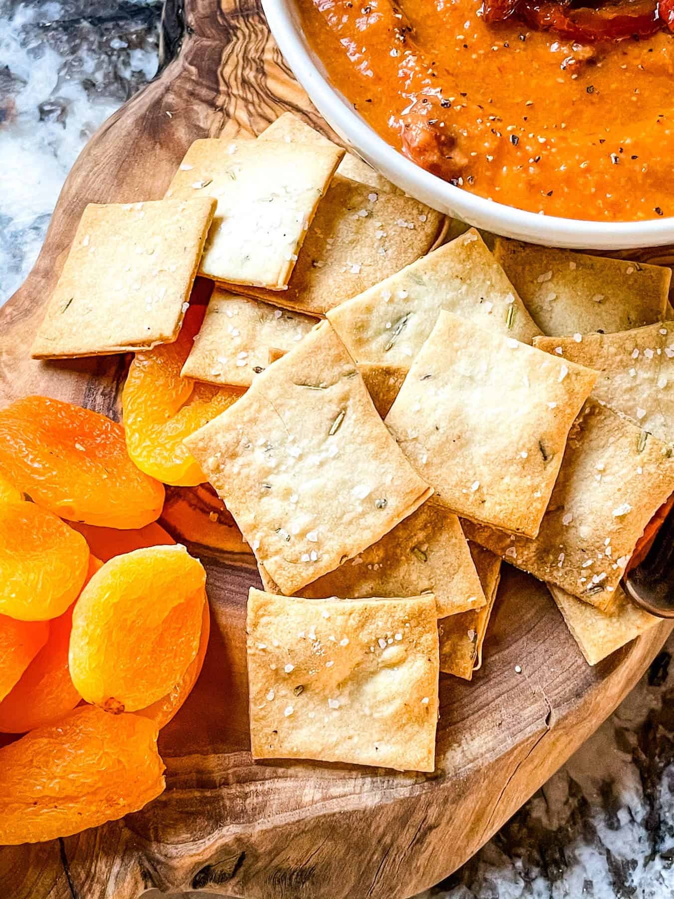 A pile of the crackers on a charcuterie board