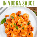 Pin image of Shrimp in Vodka Sauce on a white plate with title at top