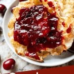 Pin image for Cranberry Jam with jam on an English muffin and title at bottom