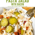 Pin image for a fork digging into Dill Pickle Pasta Salad with Bacon with title at top