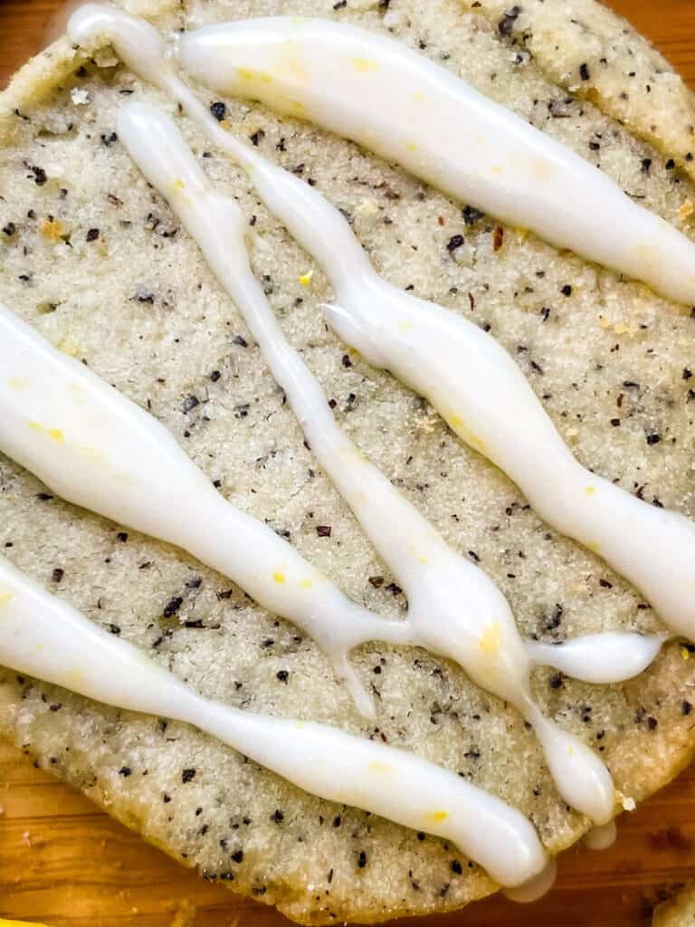 A close up of the cookie with drizzled glaze