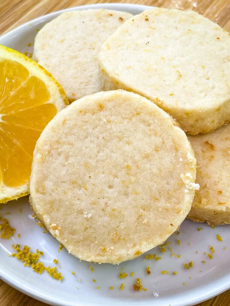 A pile of Lemon Shortbread on a plate without glaze