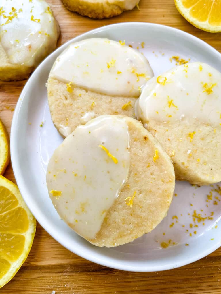 A picture of three Lemon Shortbread on a small round white plate from top