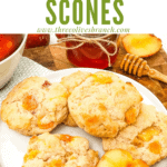 A pile of Peach Scones on a white plate with title at top