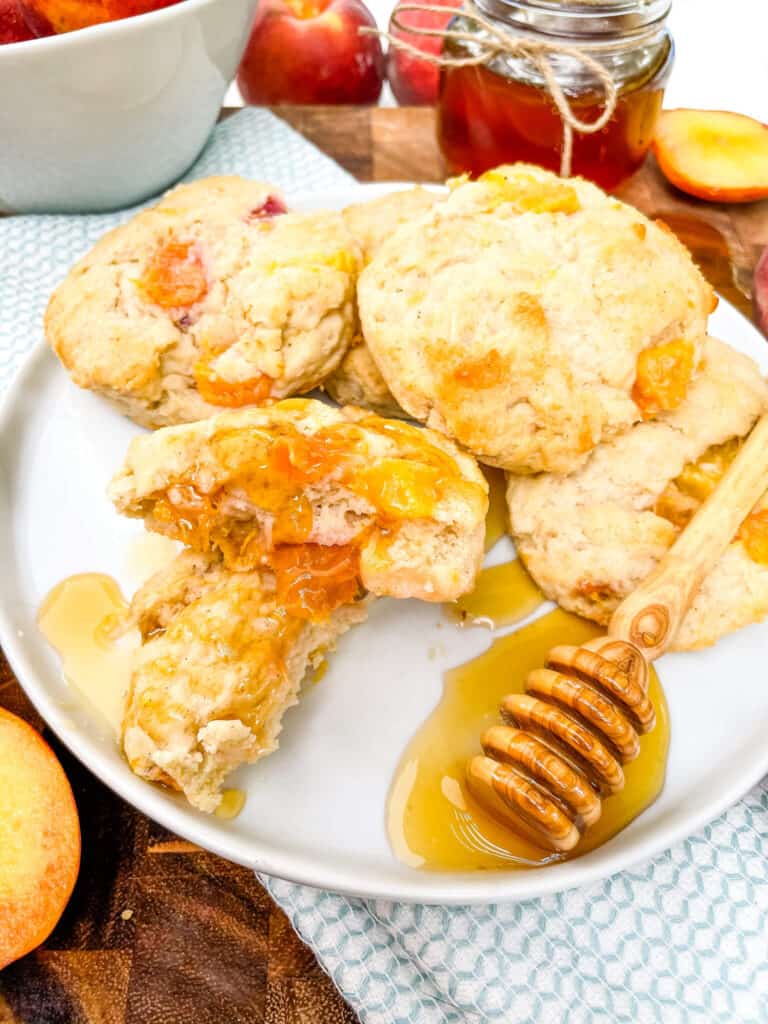 Peach Scones on a plate with honey