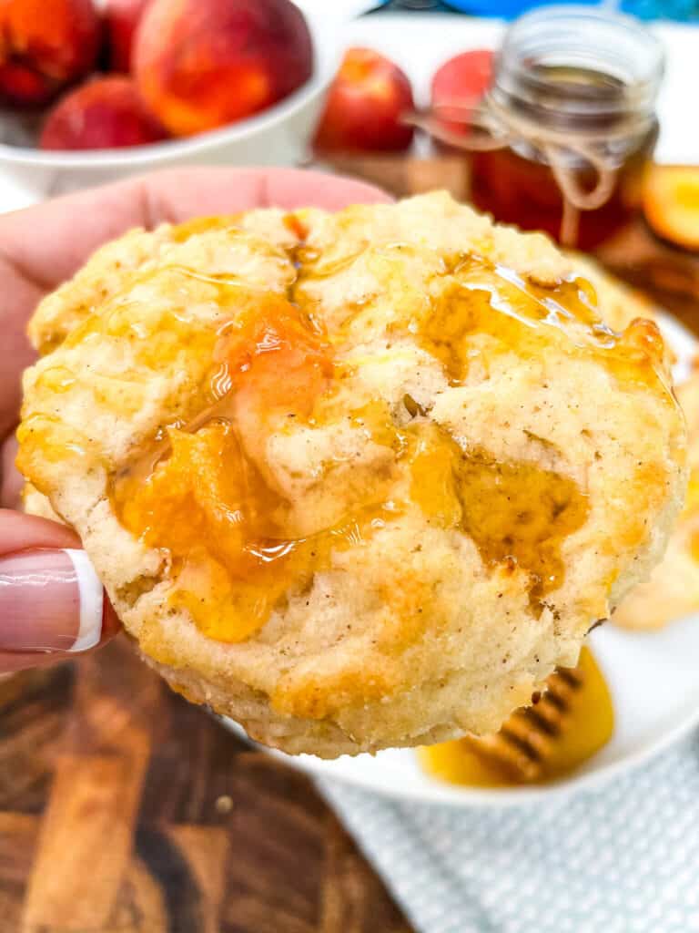 A hand holding a pastry close up