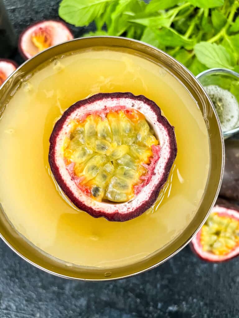 Close up top view of Pornstar Martini with passion fruit floating in it