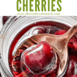 Pin image of a spoon scooping a Brandied Cherries with title at top