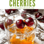 Pin image for Brandied Cherries on a cocktail with title at top