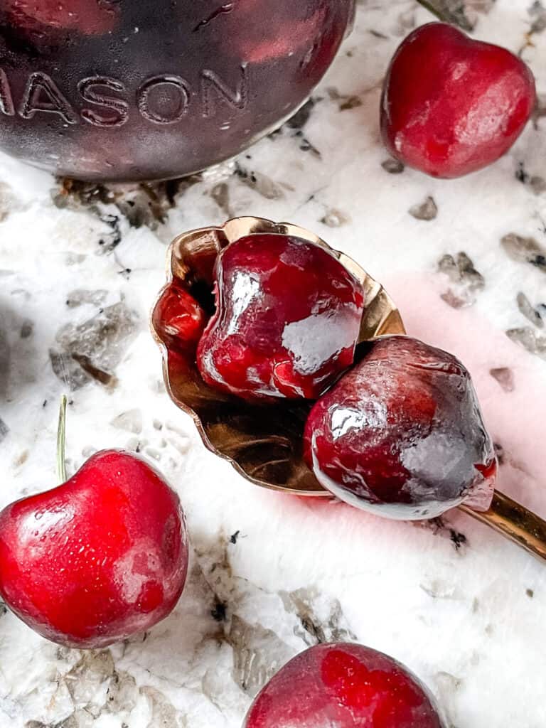 A spoon with the fruit on a counter