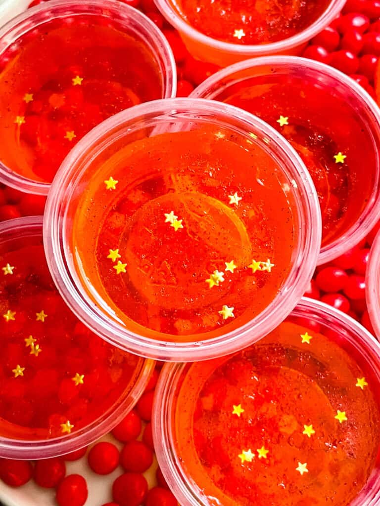 Close up of Fireball Jello Shots with gold star sprinkles