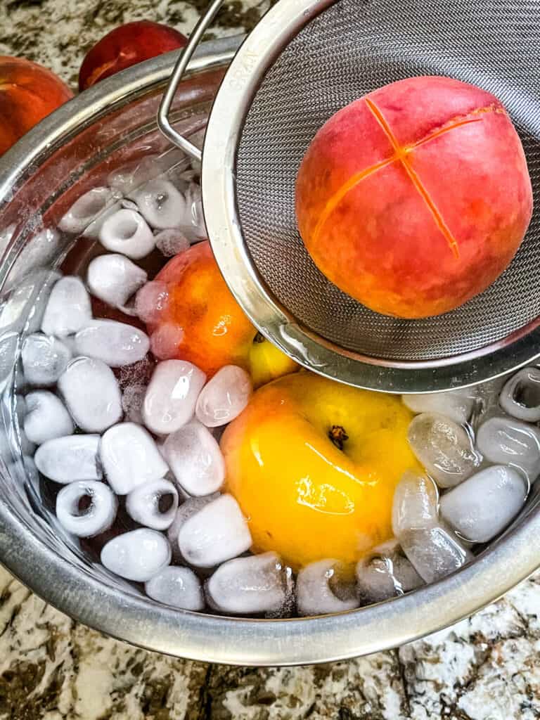 Adding peaches to ice water