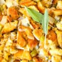 Close up of Onion and Sage Stuffing (Dressing) with sage leaves on top