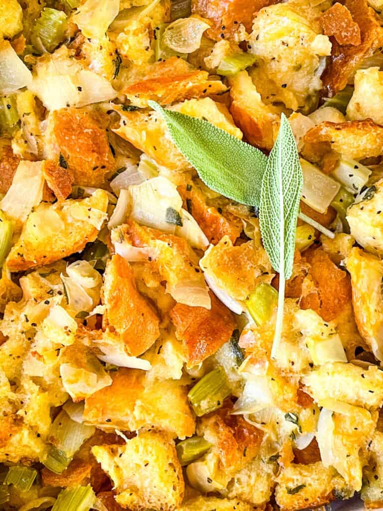 Close up of Onion and Sage Stuffing (Dressing) with sage leaves on top