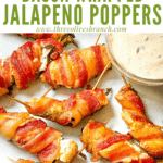 Pin image of Smoked Jalapeno Poppers on a white plate with title at top