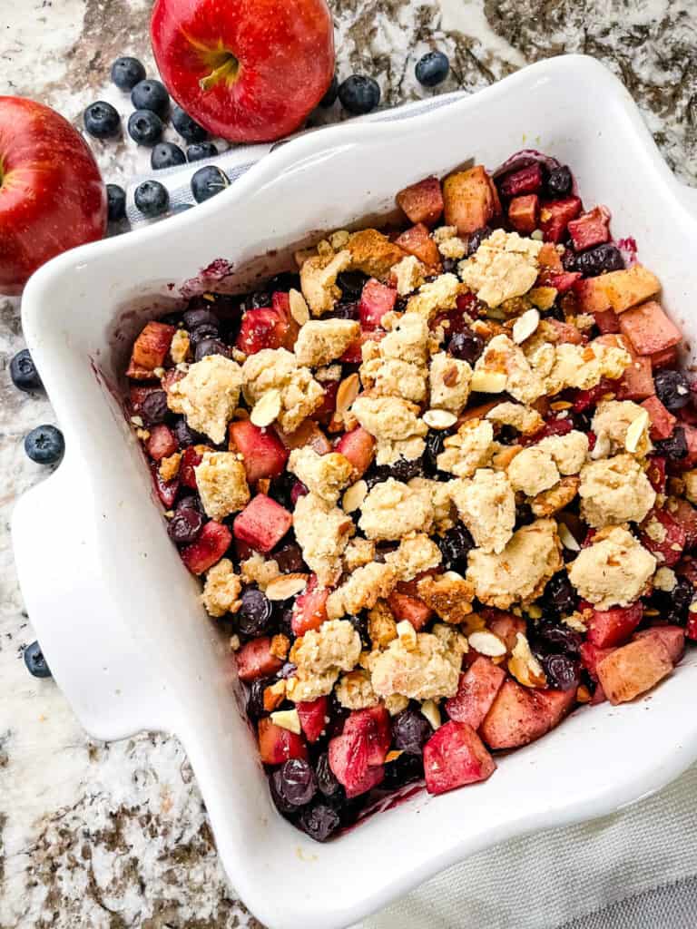 Top view of the Apple and Blueberry Crumble in a white square dish