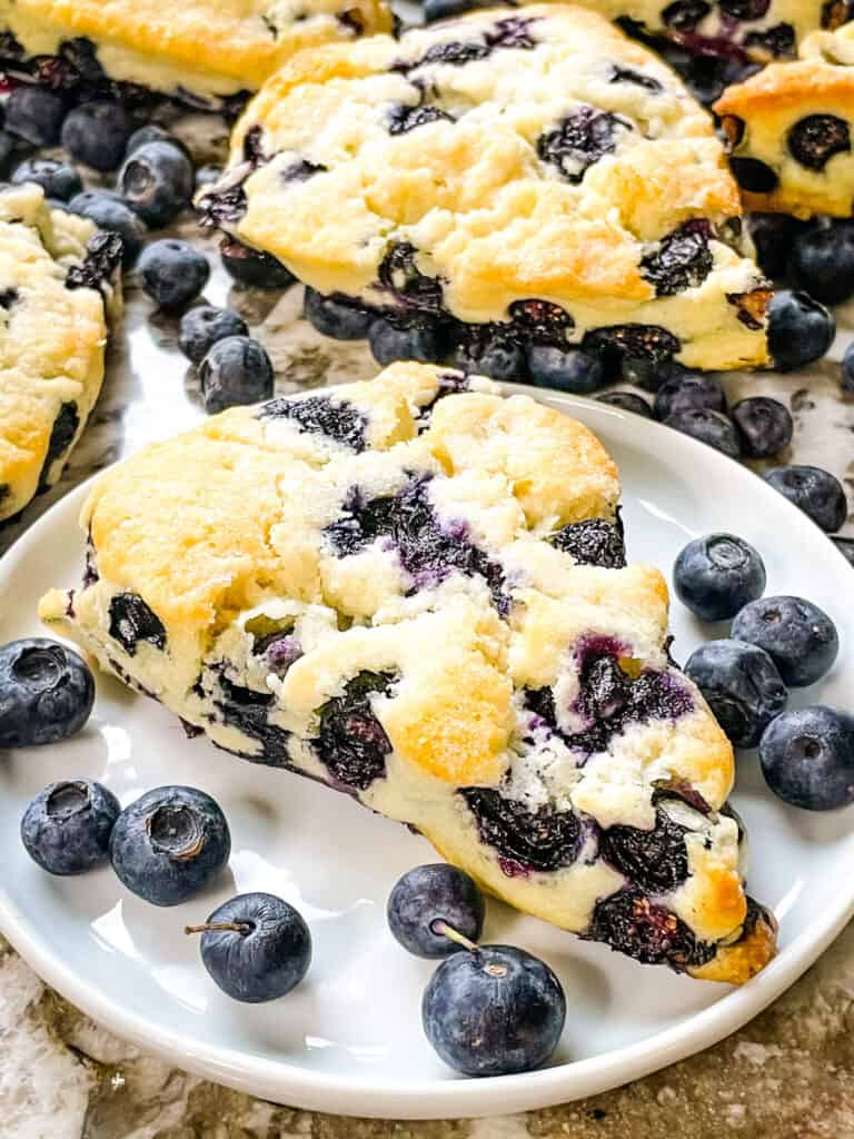 A blueberry scone on a white plate