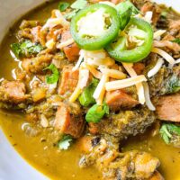 The Hatch Pork Green Chili in a bowl with toppings