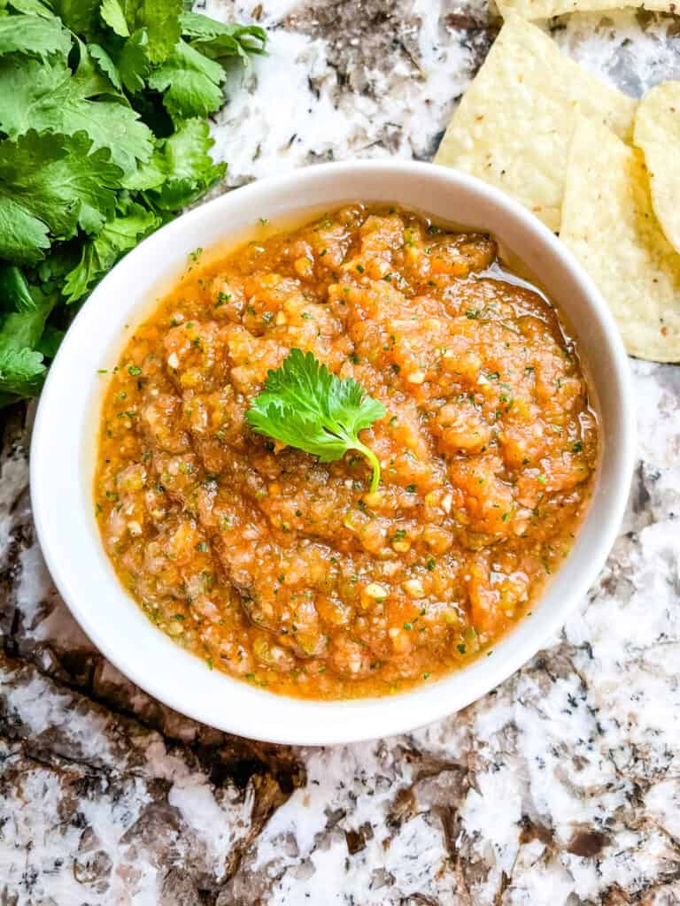 Top view of a small white bowl full of Ranchera Salsa