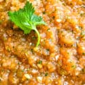 Close up of Ranchera Salsa with a cilantro leaf on top