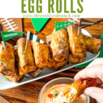 Pin image of Buffalo Chicken Egg Rolls on a platter with title at top